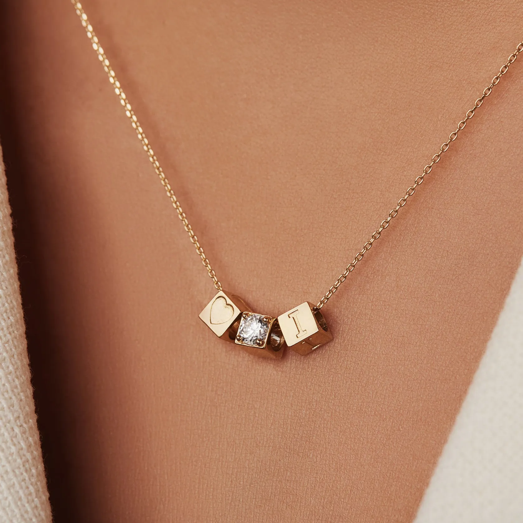 Le Marais Felie 14 karat gold cube charm with zirconia stone