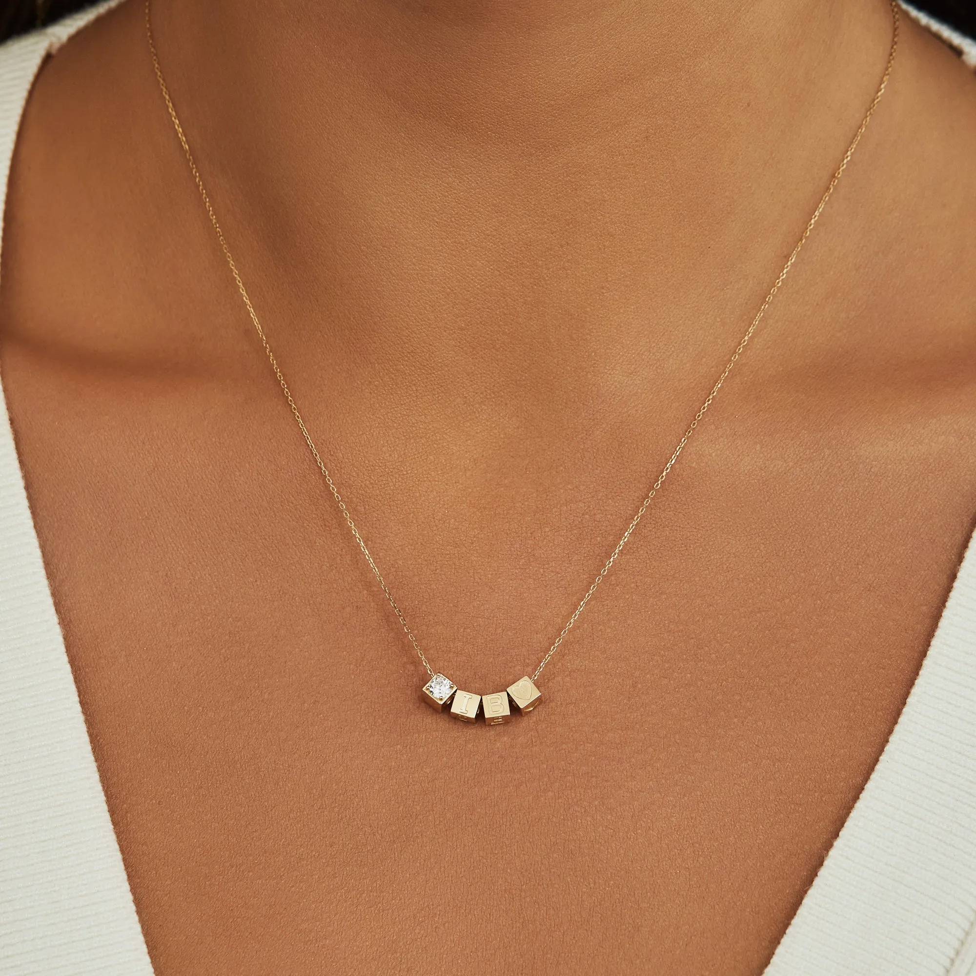 Le Marais Felie 14 karat gold cube charm with zirconia stone