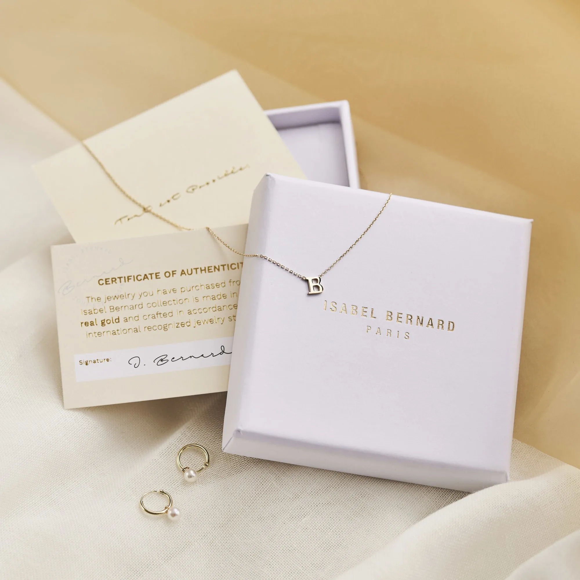 Le Marais Felie 14 karat gold cube charm with zirconia stone