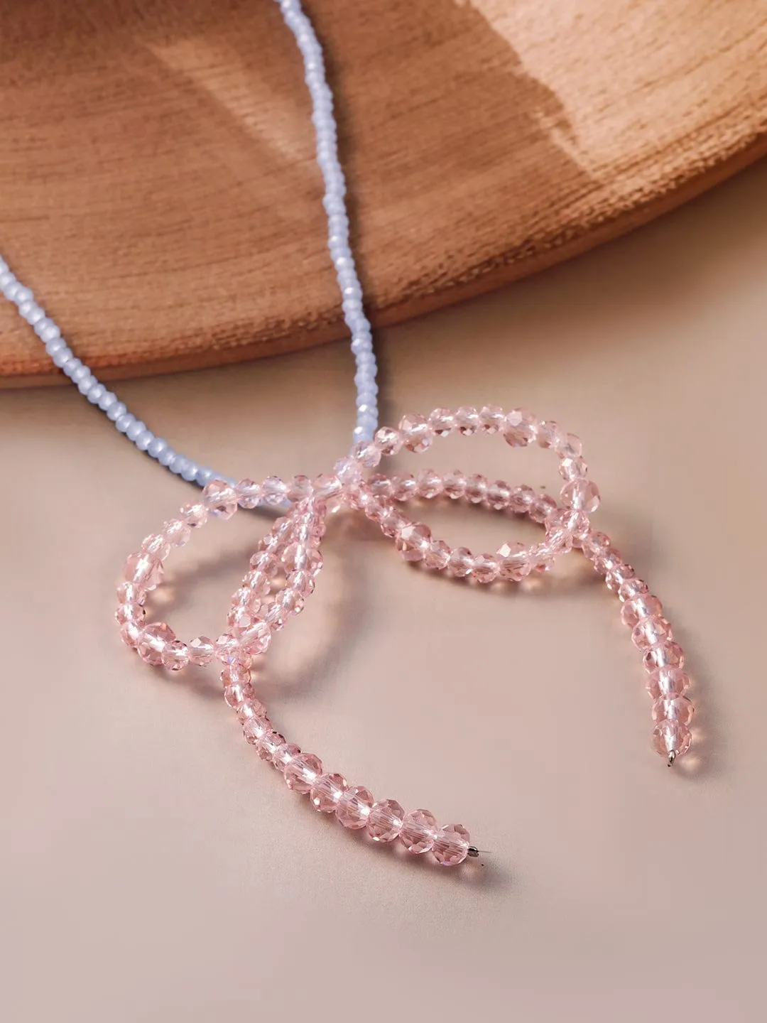 Rubans hodium Plated Blue Beaded Necklace with Pink Crystal Bow Pendant