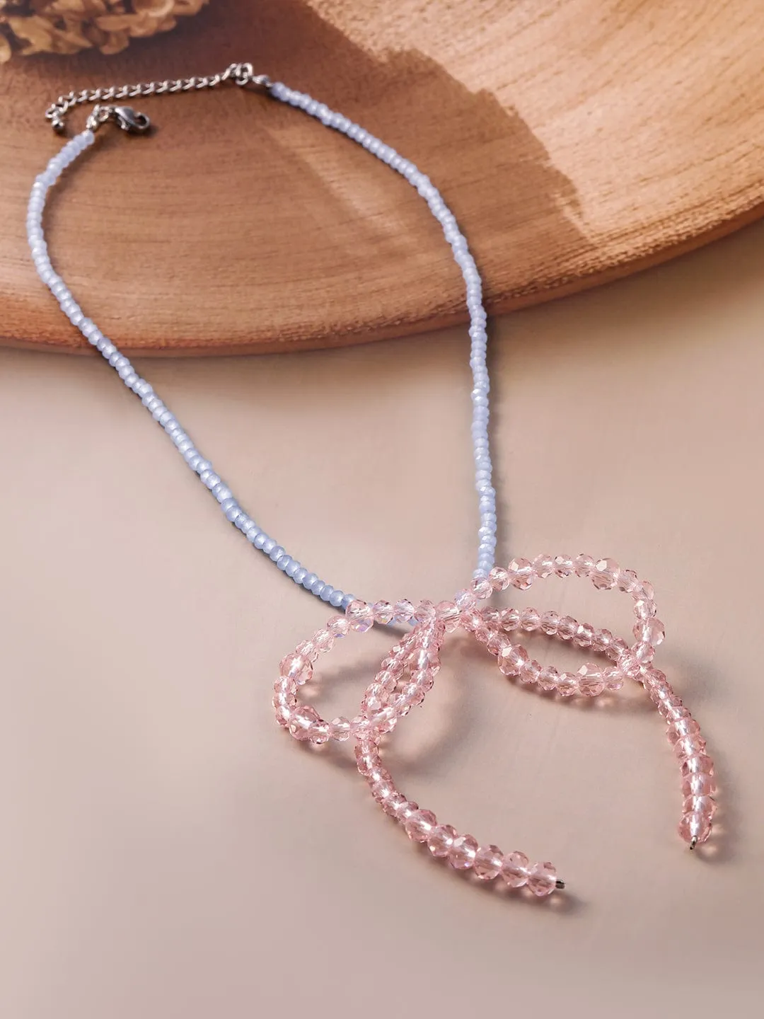 Rubans hodium Plated Blue Beaded Necklace with Pink Crystal Bow Pendant